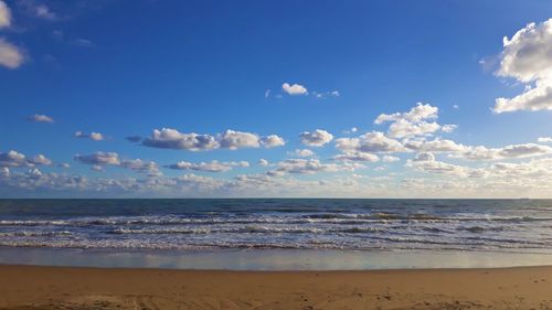 Scenic view of beach against sky