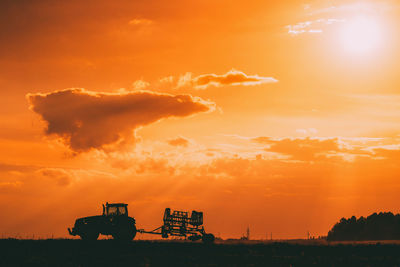 Scenic view of field against sky during sunset