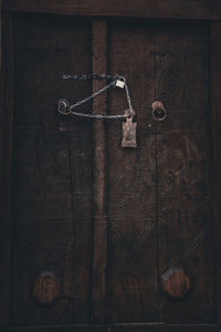 Close-up of metal hanging on rope