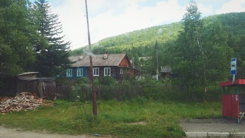 Houses against mountain range