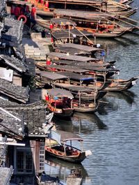 High angle view of boats moored at harbor