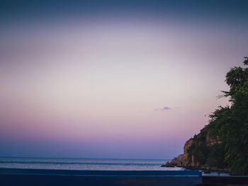 Scenic view of sea against sky at sunset