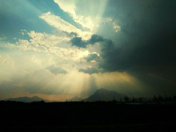 Silhouette landscape against sky during sunset