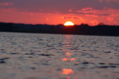 Scenic view of sunset over river