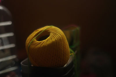 Close-up of yellow thread spool