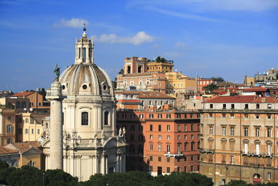 Buildings in city against sky