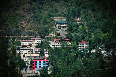 High angle view of buildings and trees in town