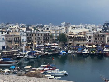 Boats moored at harbor