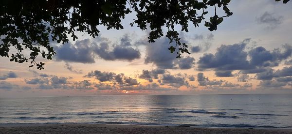 Scenic view of sea against sky at sunset