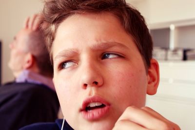 Close-up of thoughtful boy at home