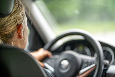 Rear view of woman in car