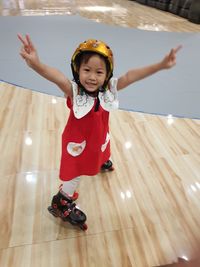Full length portrait of cute girl standing on floor