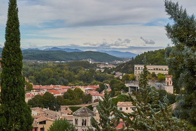 High angle view of townscape and mountains against sky