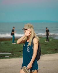 Young woman standing on beach