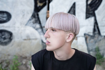 Close-up of teenager standing outdoors