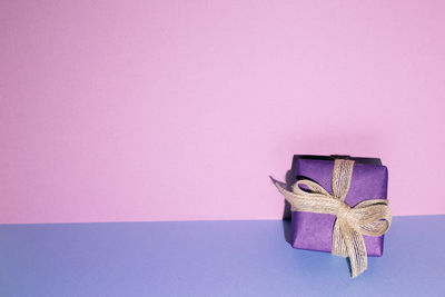 High angle view of gift box on blue background