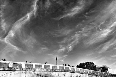 Low angle view of building against cloudy sky