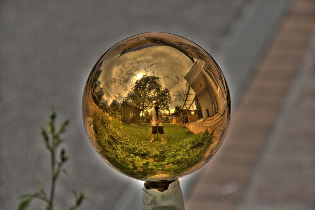 transparent, reflection, glass - material, indoors, tree, circle, sphere, focus on foreground, close-up, sky, day, selective focus, green color, glass, water, focus on background, lighting equipment, nature