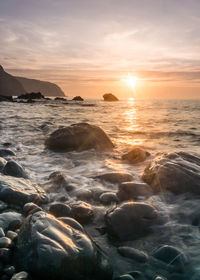 Scenic view of sea against sky during sunset