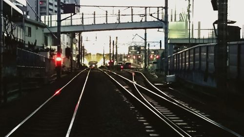 Train at railroad station against sky