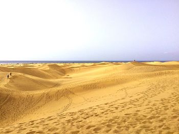 Scenic view of desert against clear sky