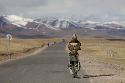 Man hiking on road