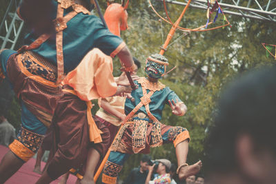 Rear view of boys on tree