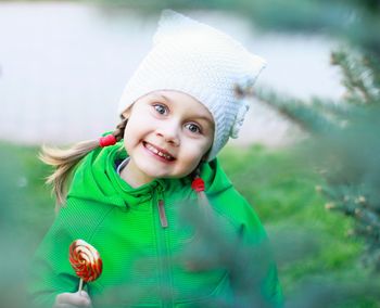 Portrait of cute girl holding lollypop