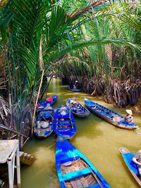 Boats moored in river