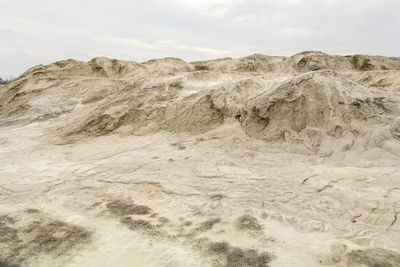 Rock formations in desert against sky