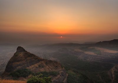 Scenic view of landscape against sky during sunset
