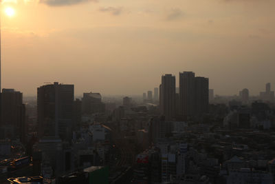 High angle view of buildings against sky during sunset