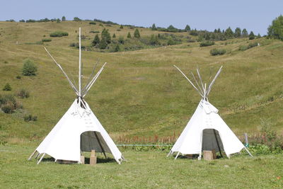 Tent on field against sky