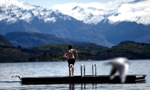 Scenic view of lake with mountains in background