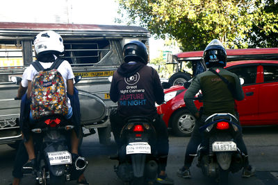 Rear view of people on street