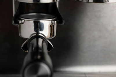 A closeup shot of an espresso coffee machine