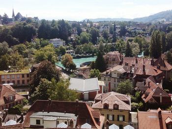 High angle view of houses and trees against sky