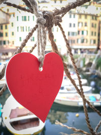 Close-up of padlocks hanging on rope