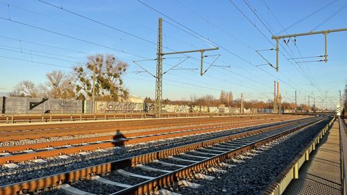 Railroad station platform against clear sky