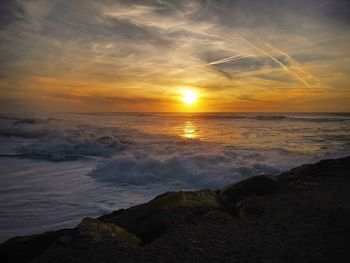 Scenic view of sea against sky during sunset