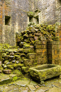 Stone wall against brick wall