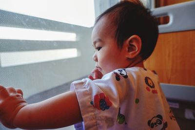 Portrait of cute baby girl at home