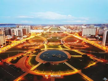 Aerial view of illuminated cityscape against sky