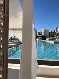 View of swimming pool with buildings in background