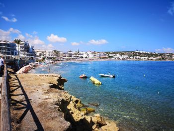 Scenic view of sea against blue sky