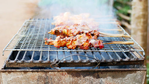 Autumn leaves on barbecue grill