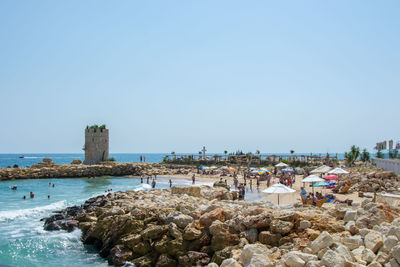 Panoramic view of beach against clear sky