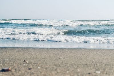 Scenic view of beach against clear sky