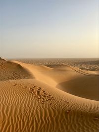 Scenic view of desert against clear sky