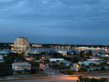 High angle view of illuminated buildings against sky at dusk